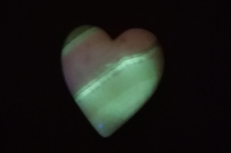 phosphorescent peruvian ping aragonite glowing in the dark