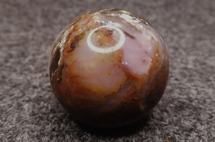 Pink boulder opal sphere