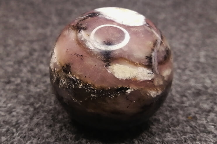 Pink boulder opal sphere