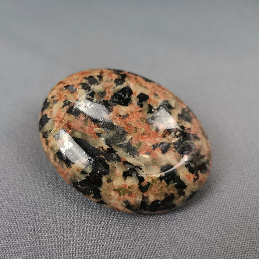 Rhodonite with epidote worry stone