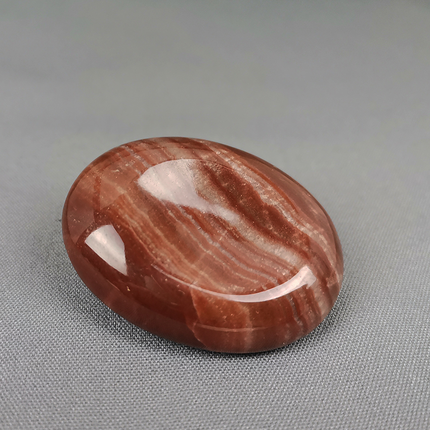 red aragonite worry stone