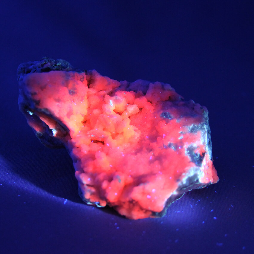 Fluorescent Manganocalcite crystals offered by Gemrock Peru in Flats
