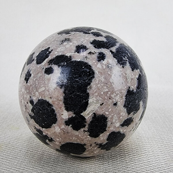 Dalmatian-stone-sphere-1 ti Rhodonite with green epidote