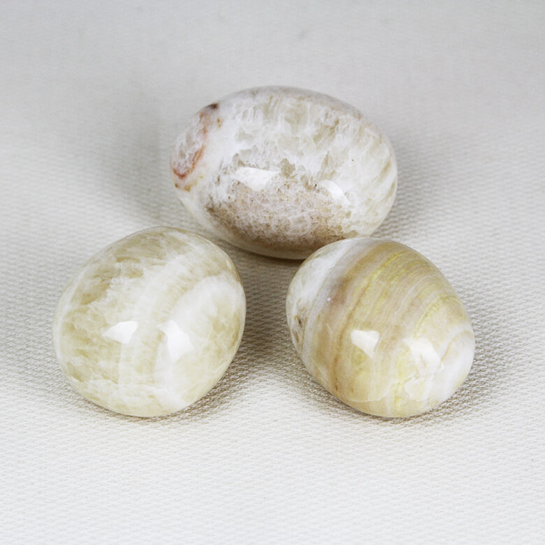 Coati Aragonite tumbled stones ethical crystals Gemrock