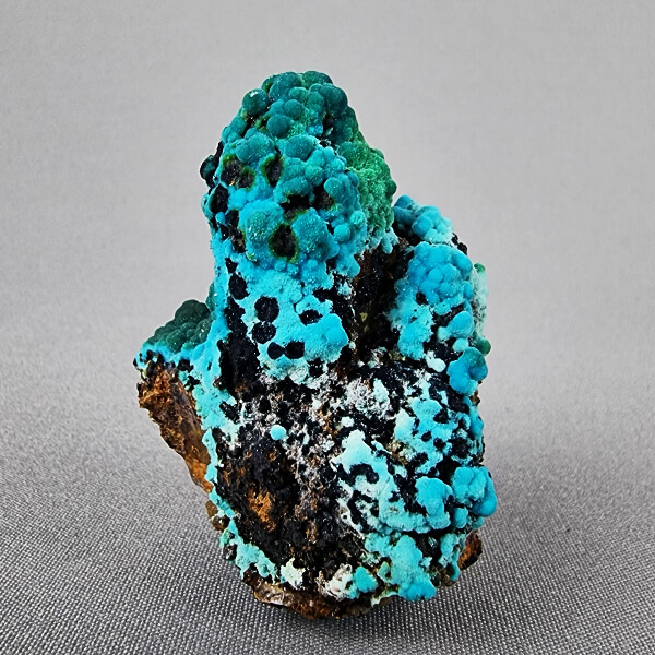 Quartz-crystal-cluster-with-chrysocolla-and-malachite-from-Tentadora-mine-Peru-ti
