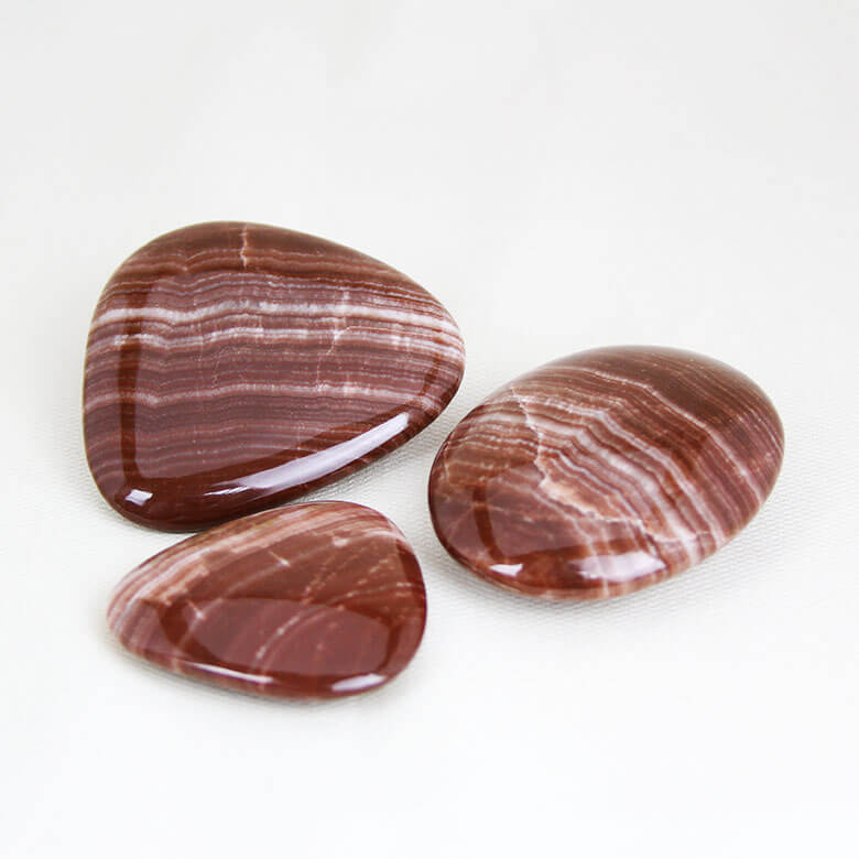 Red Aragonite palm stones ethical Crystals Gemrock 01