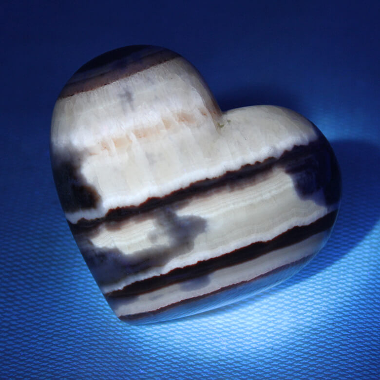 Tiger Aragonite heart ethical crystals Gemrock 03c fluorescent under UV light