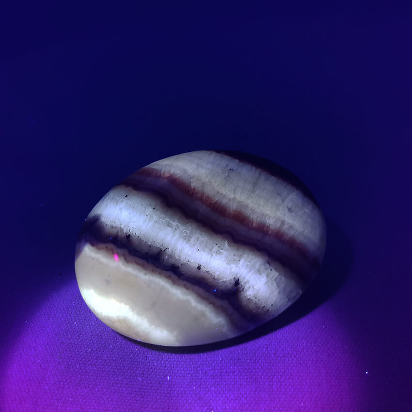 Tiger Aragonite worry stone ethical crystals Gemrock 02b fluorescent under UV light