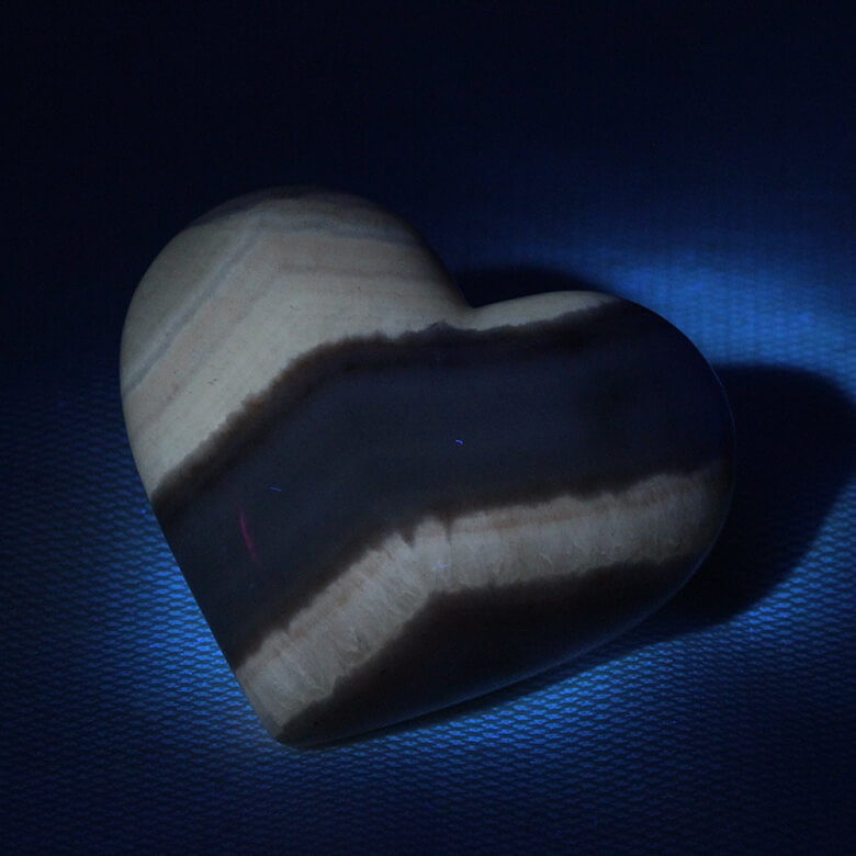 fluorescent coati aragonite heart under UV light ethical Crystals Gemrock 2