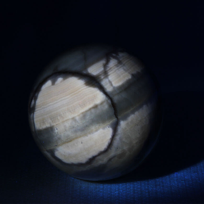 fluorescent coati aragonite sphere under UV light ethical Crystals Gemrock 1